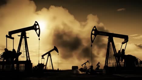 silhouetted oil pumps against a dramatic sunset sky: a stunning visual of oil extraction efforts and industrial landscape