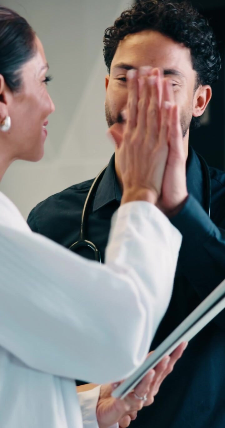 Two Doctors Discussing Medical Data on a Tablet