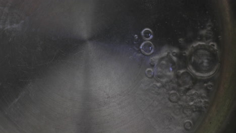 water bubbling on a hot pan, a familiar and comforting sight in the kitchen