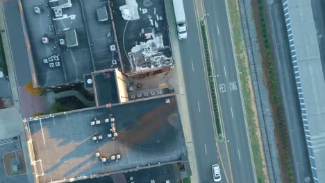 aerial moving shot over building tops in downtown city