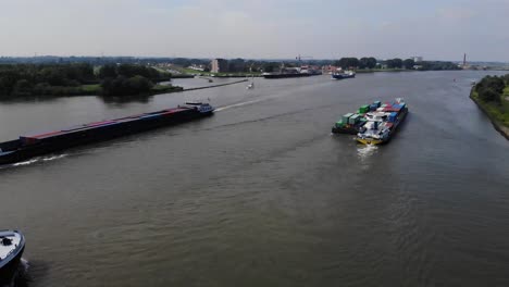 lot of barges passing each other on a dutch river