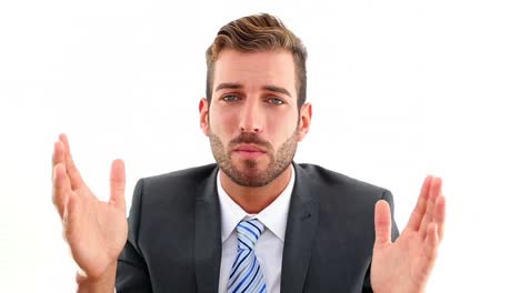 smiling businessman talking to camera