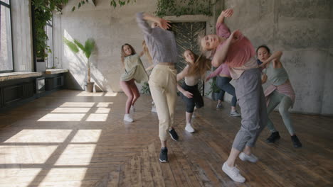 group of women dancing in a dance studio