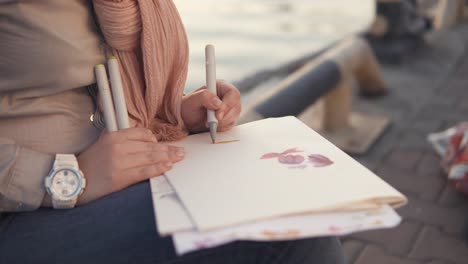 woman drawing outdoors