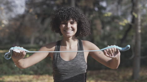 instructor cross training using a elastic band slowly