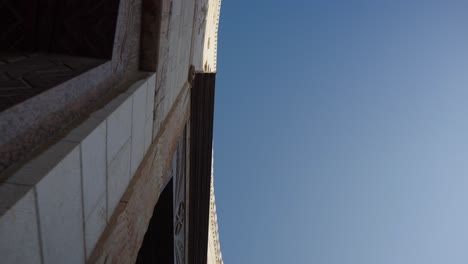 skyward pov: curved front facade of annunciation basilica in nazareth