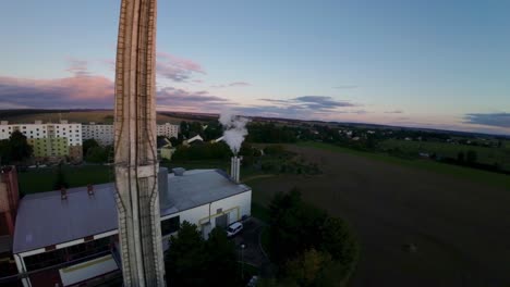 Thermal-power-plant-producing-heat-for-households-and-emitting-white-smoke-during-the-energy-crisis-in-Europe-at-the-beginning-of-a-chilly-autumn