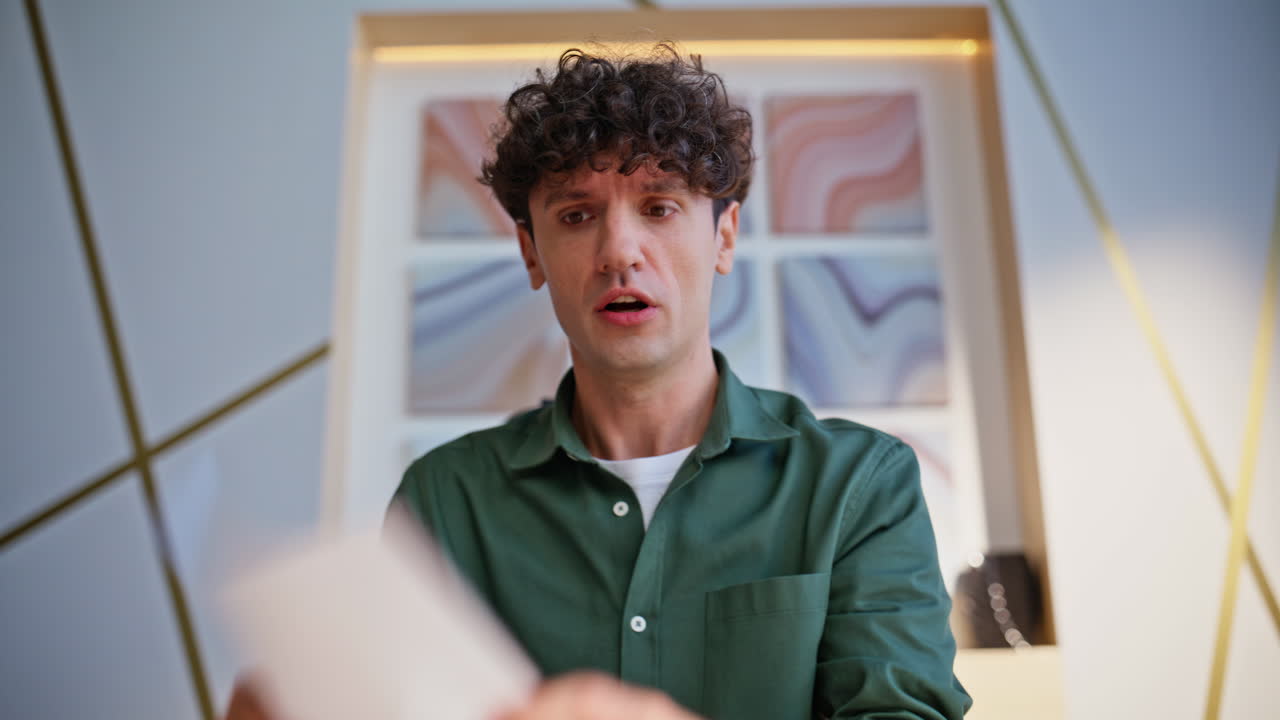 Man with Curly Hair Expressing Surprise