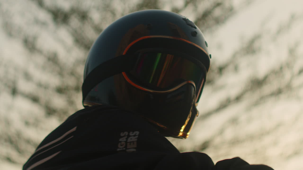 Close-up of a Person Wearing a Vintage Motorcycle Helmet and Goggles