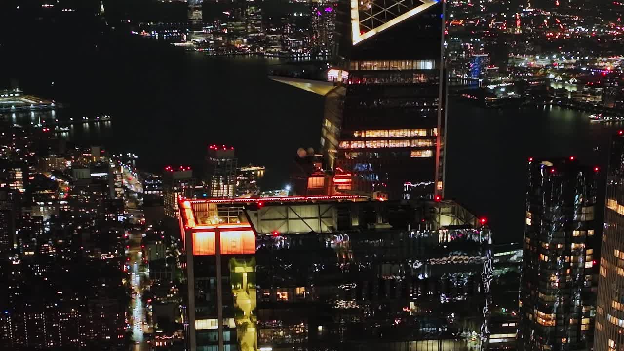 Vibrant night skyline view of New York City from a drone aerial perspective