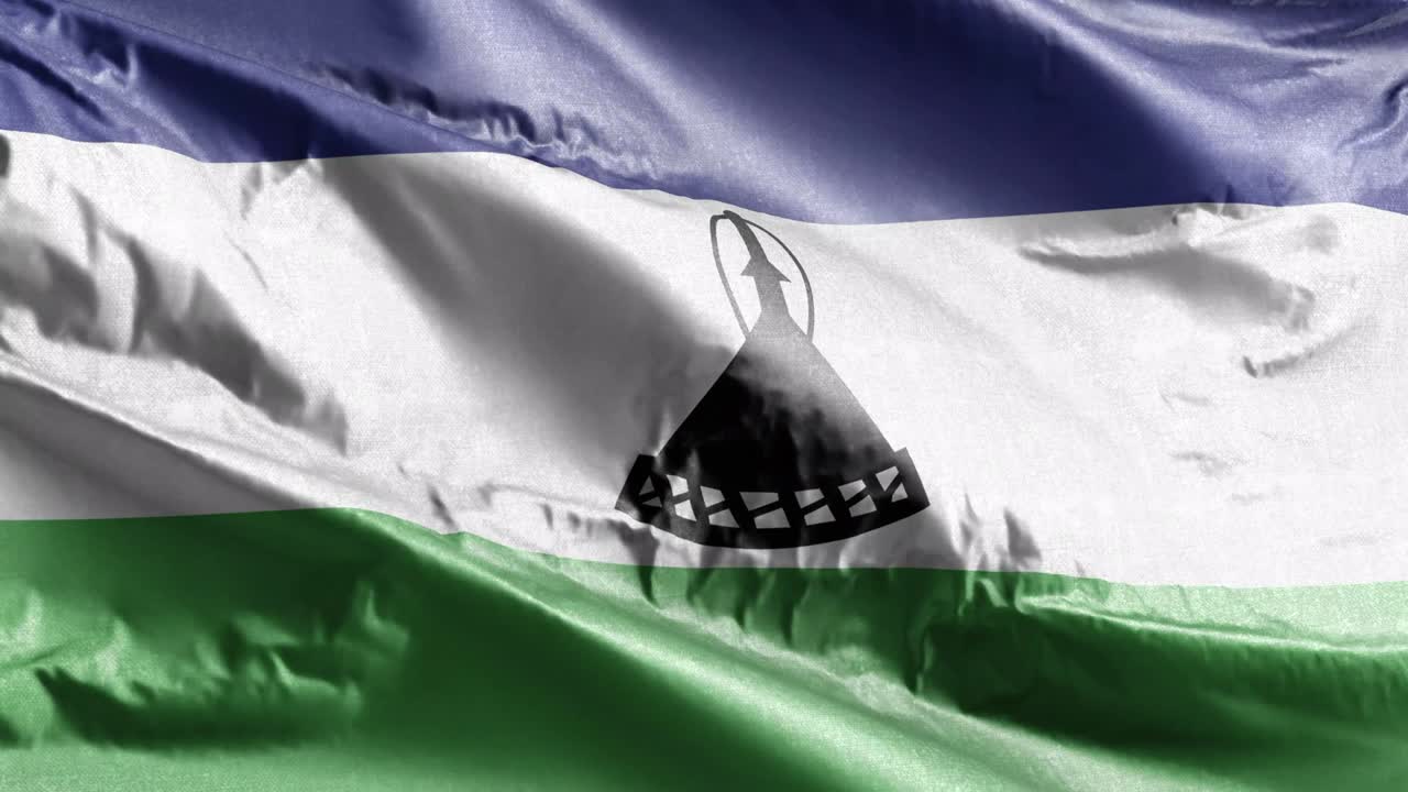 bandera textil de lesotho ondeando en el bucle del viento. bandera de lesotho balanceándose en la brisa. tejido textil de tela. fondo de relleno completo. bucle de 10 segundos.