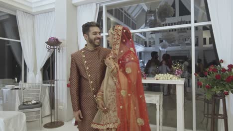 happy hindu bride and groom during wedding ceremony - medium shot