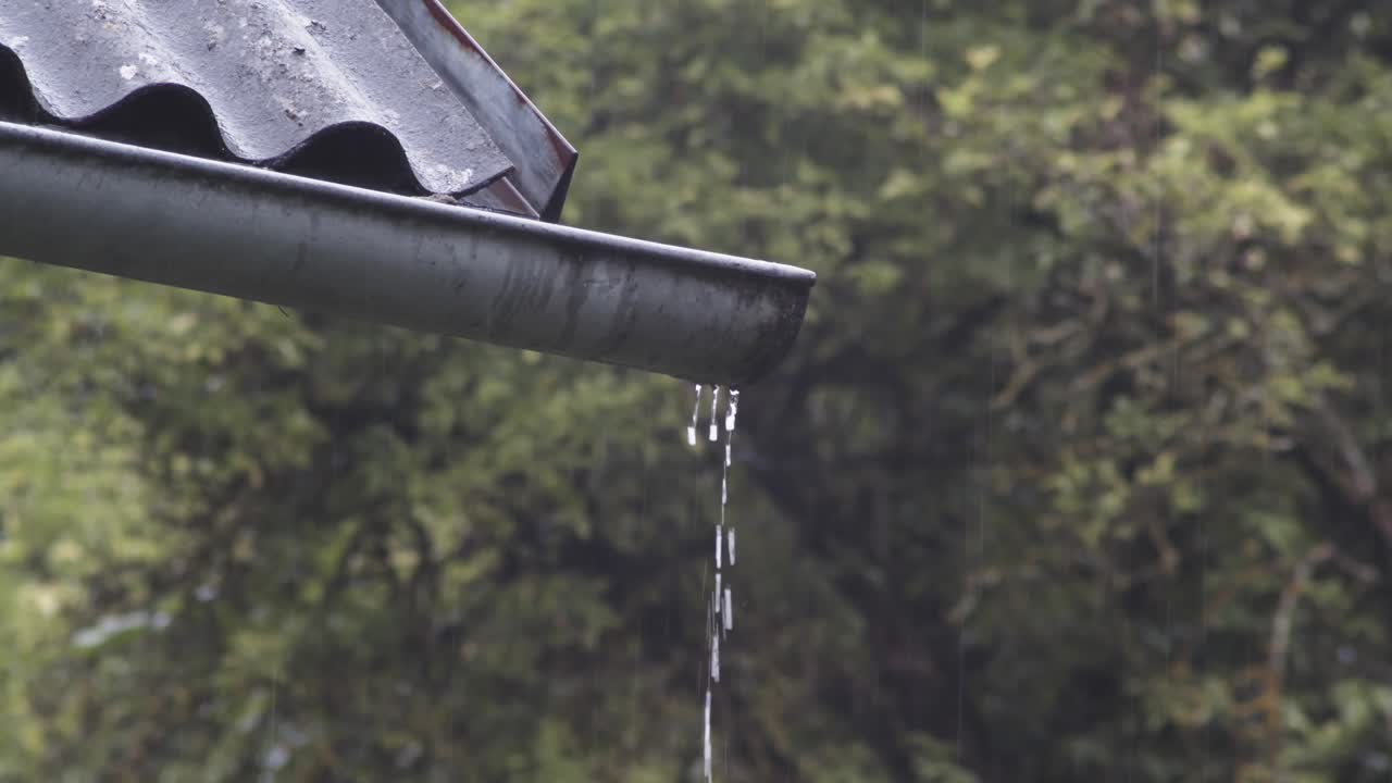 Rain Pouring Down On The Roof And Dripping On The Water Drainage
