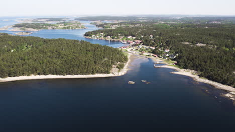 seaside town with forested background in salto island, strömstad sweden