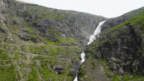 Huge-Waterfall-Of-Stigfossen-Between-The-Rocky-Canyon-Near-Trollstigen-In-Norway