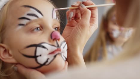 close up video of face painting for easter bunny