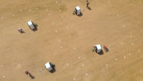 Aerial-view-of-archers-practicing-archery-at-boot-camp-4k