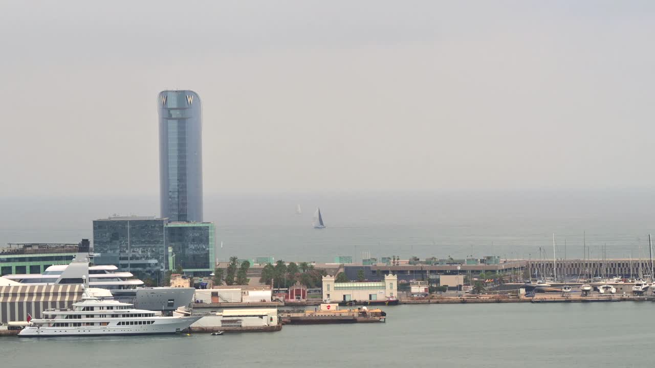 Aerial drone view of boats docked in the Port Vell in Barcelona, Spain
