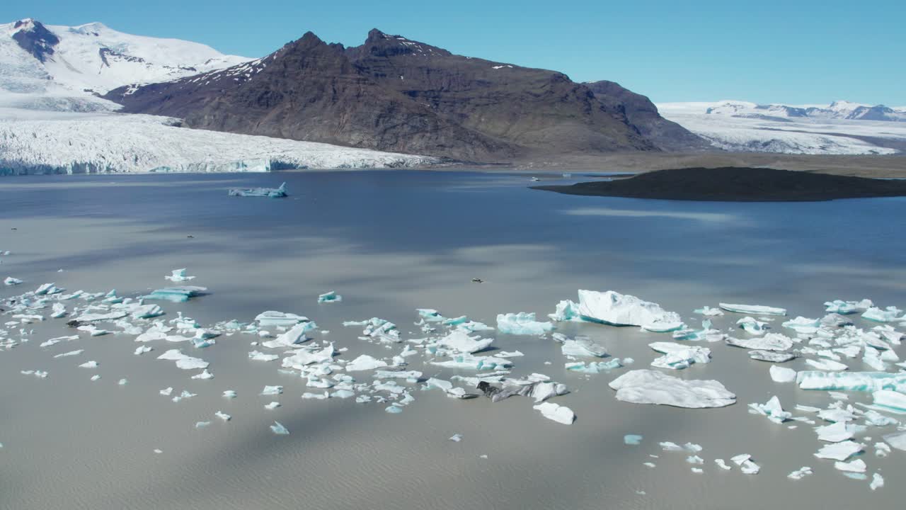 Aerial view of icebergs floating near Vatnajokull glacier in Iceland.