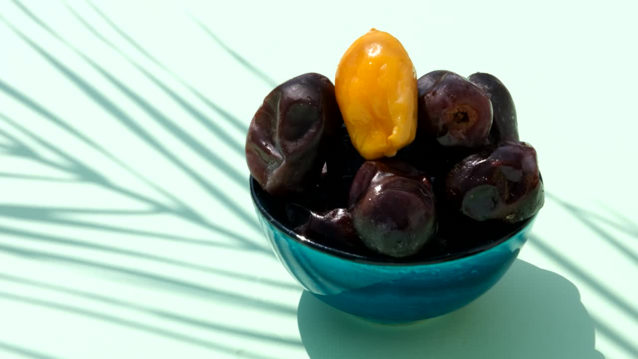 Fresh date fruit under sunlight.