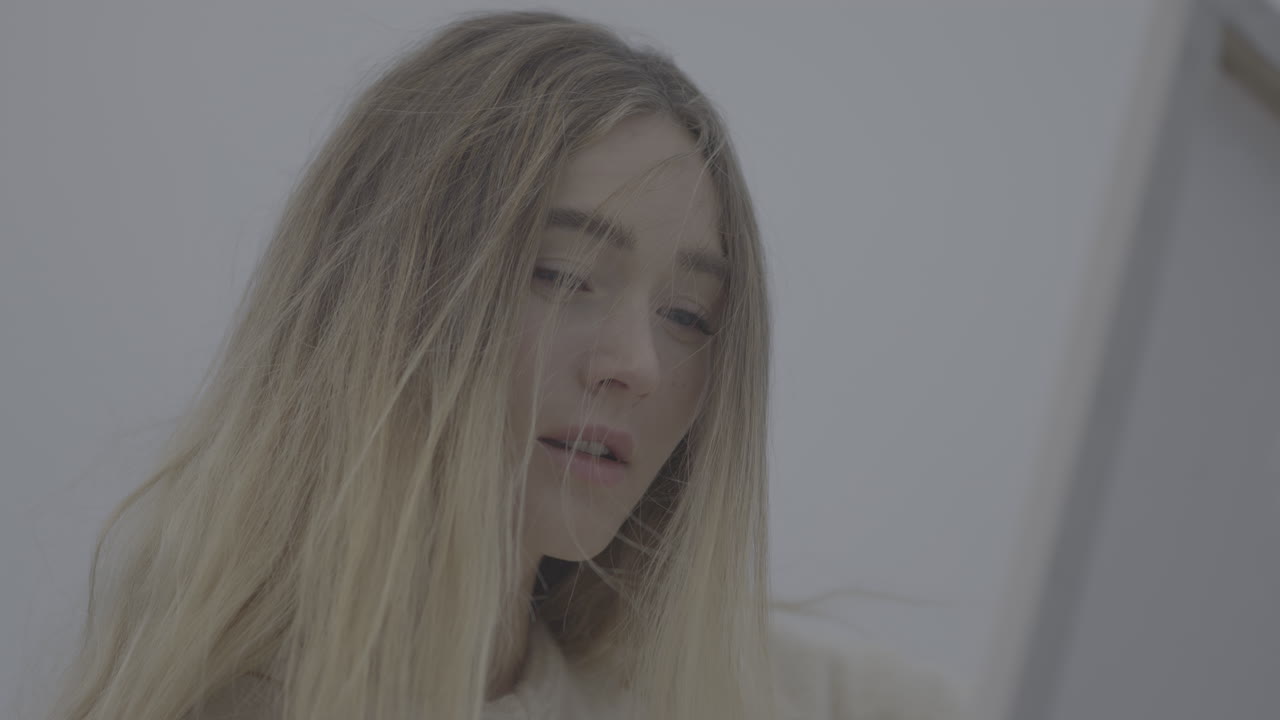 Close-up of a young woman with blonde hair