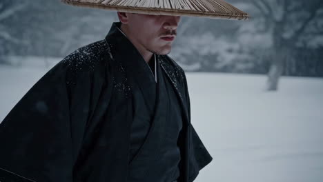 man in traditional japanese clothing in the snow