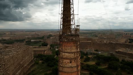 aerial view of a tall abandoned industrial chimney