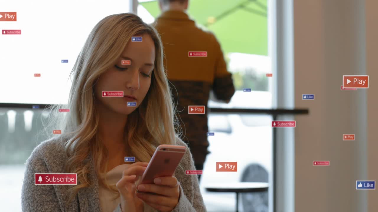 Animation of notification icons over beautiful caucasian young woman using cellphone in cafes