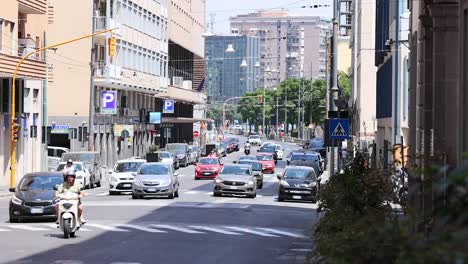 traffic and pedestrians on a bustling street