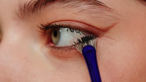 woman applying mascara