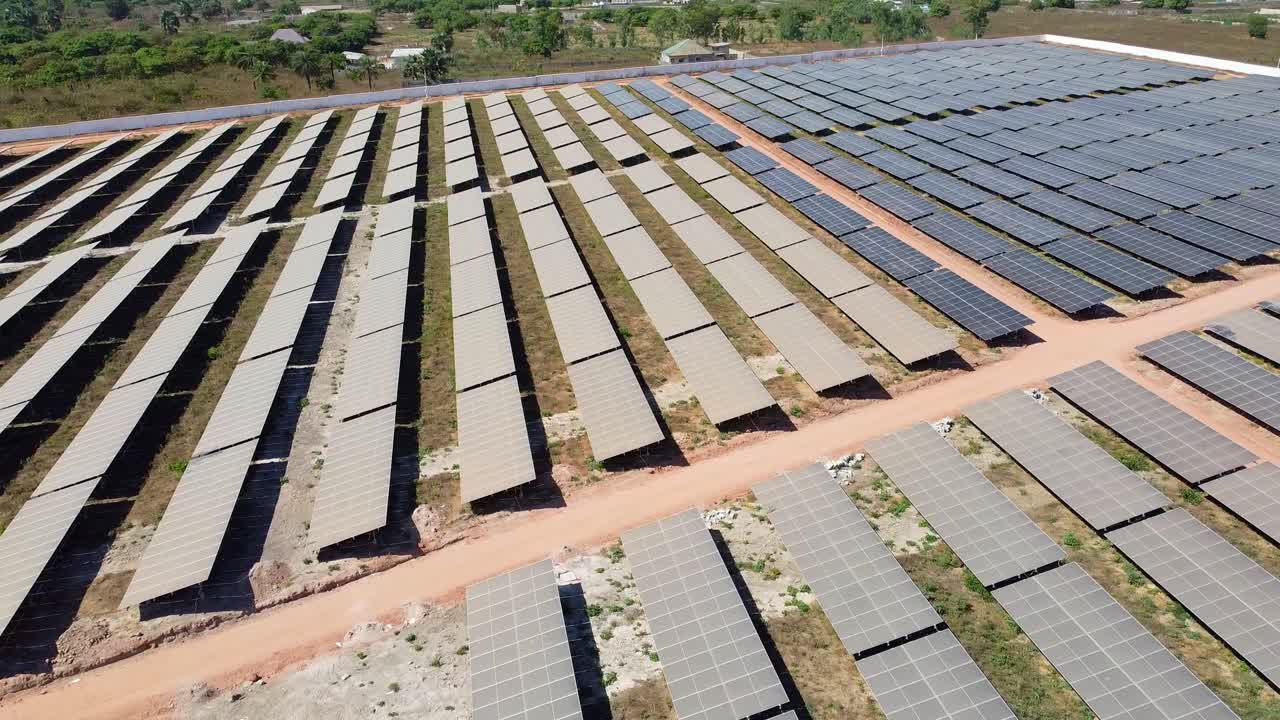 Panoramic overview of renewable energy inverters and very contrasting dirty and clean solar panels