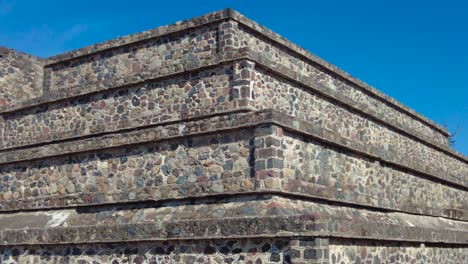 Reliefs-and-engravings-of-a-small-Teotihuacán-pyramid,-with-impressive-details