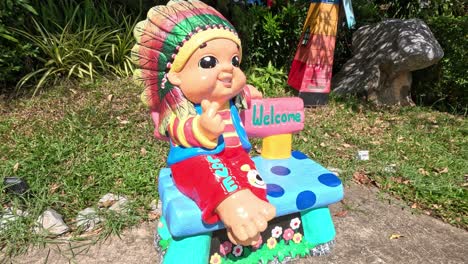 colorful doll waves in a welcoming gesture