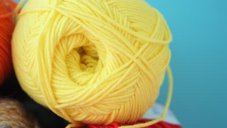 close-up of yellow and orange yarn balls