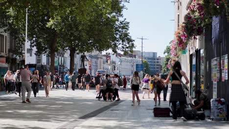 pedestrians and cyclists on a bustling street