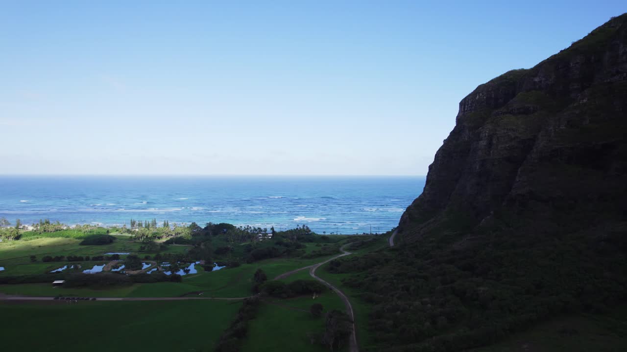 Scenic tropical coastal landscape with ocean and lush mountains