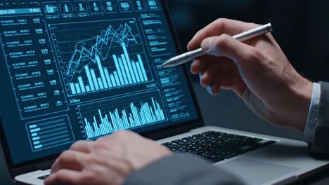 financial analyst examining stock market charts on a laptop with a stylus