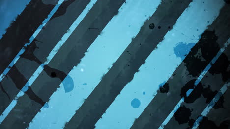 animación de rayas grises de pintura sobre un fondo azul