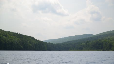 a lake with a mountain view in the background