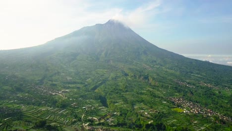 merapi volcano with rural view of plantation that planted with brocolli, cabbage, potatoes and green onions, central java, indonesia