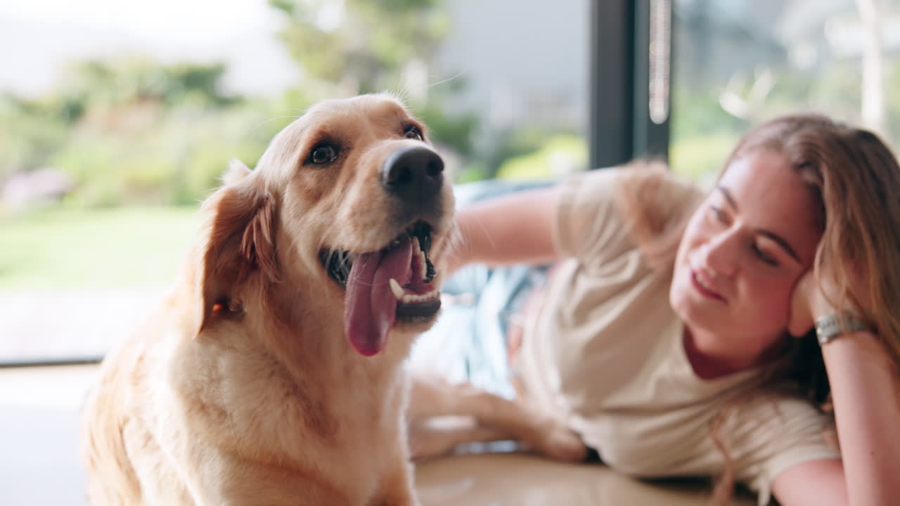 A woman and her dog lying on the floor