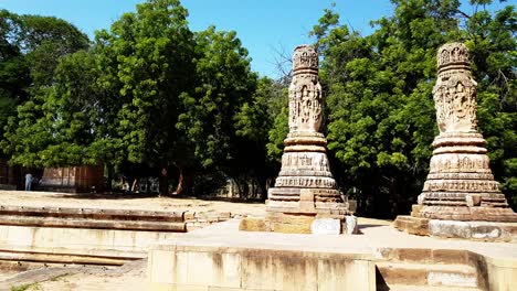 Two-pillars-standing-alone-near-the-temple,-act-as-The-Torana-or-Arched-gateway,-are-intricately-carved-at-sun-temple