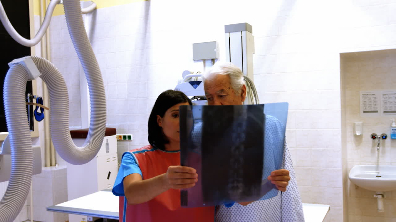 Female doctor discussing x-ray with patient