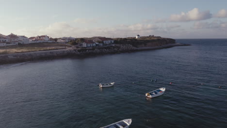 peaceful aerial view tour over quebrado's beach featuring small fishing boats detail at the golden hour bliss