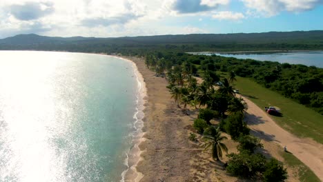 slow aerial flying backwards over sun bay beach, puerto rico