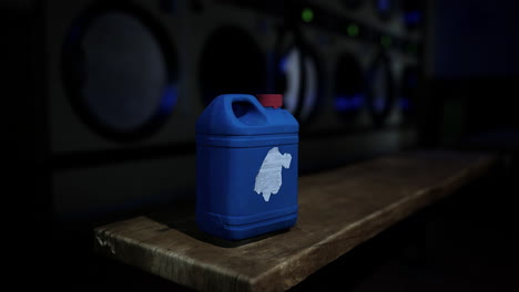 blue laundry detergent bottle in a laundry room