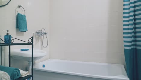 interior of stylish bathroom with turquoise accessories
