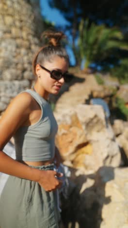 woman outdoors in a rocky, sunny environment