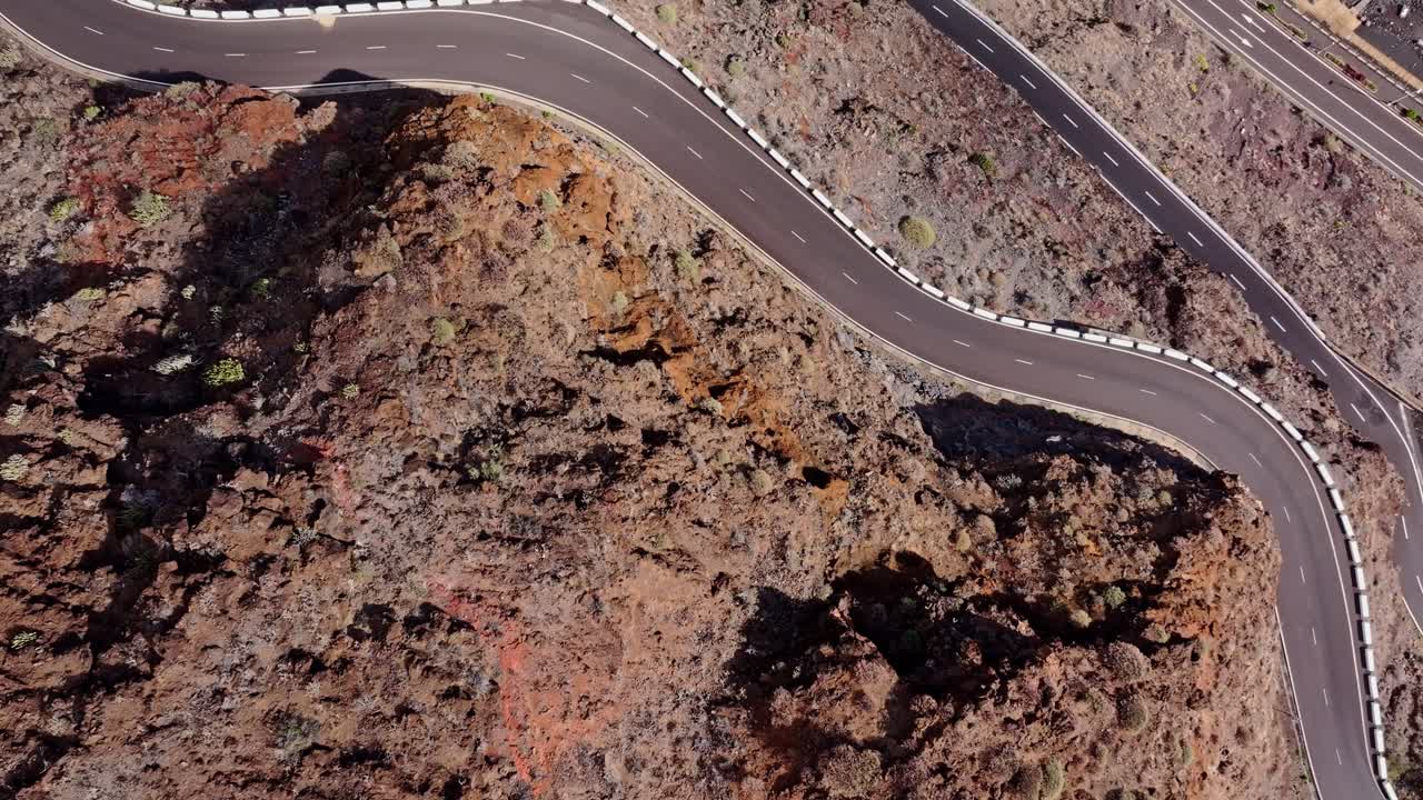 El Hierro’s twisting road carves into barren rocky slopes, dramatic texture