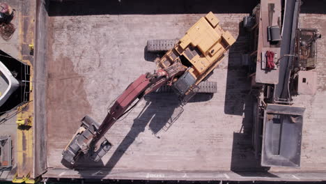 top view of loader crane unloading sand in sliding machine from sam laud freighter